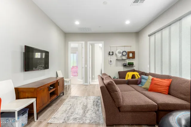 a en suite bathroom with a double vanity sink mirror and next to a window