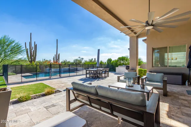 a building outdoor space with patio furniture and potted plants