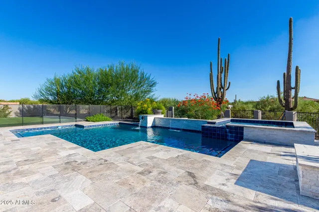 a view of a patio with a chairs and table in the patio