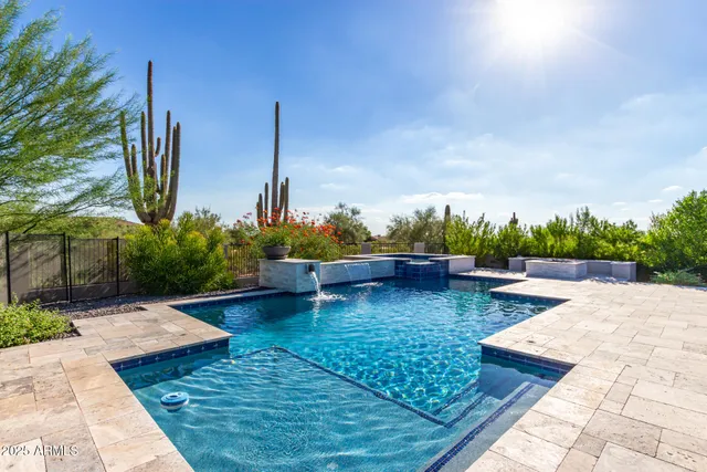 a view of a patio with swimming pool table and chairs