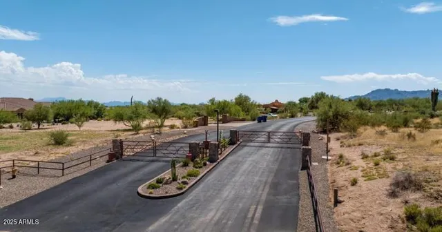 a view of a backyard of a house with table and chairs