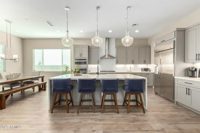 a living room with fireplace furniture and a large window