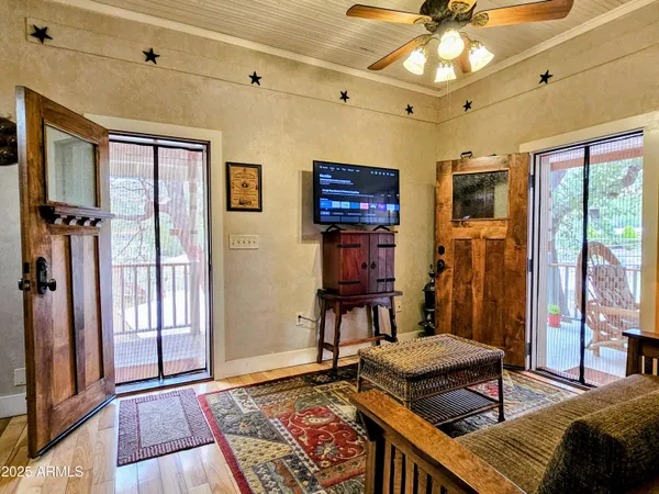 a living room with furniture and a rug