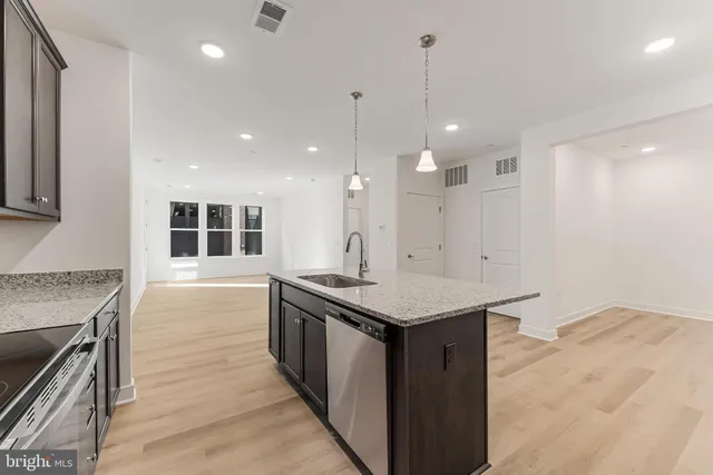 a view of room with wooden floor and fan