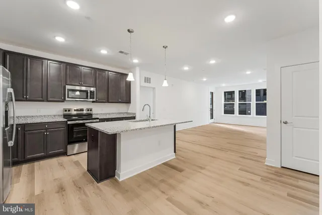 a view of hallway with wooden floor