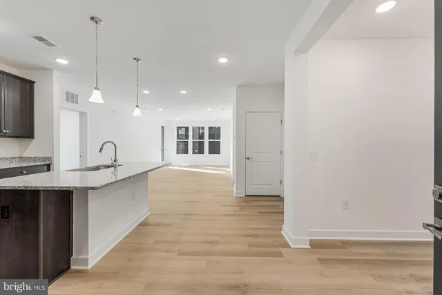 a view of kitchen with wooden floor