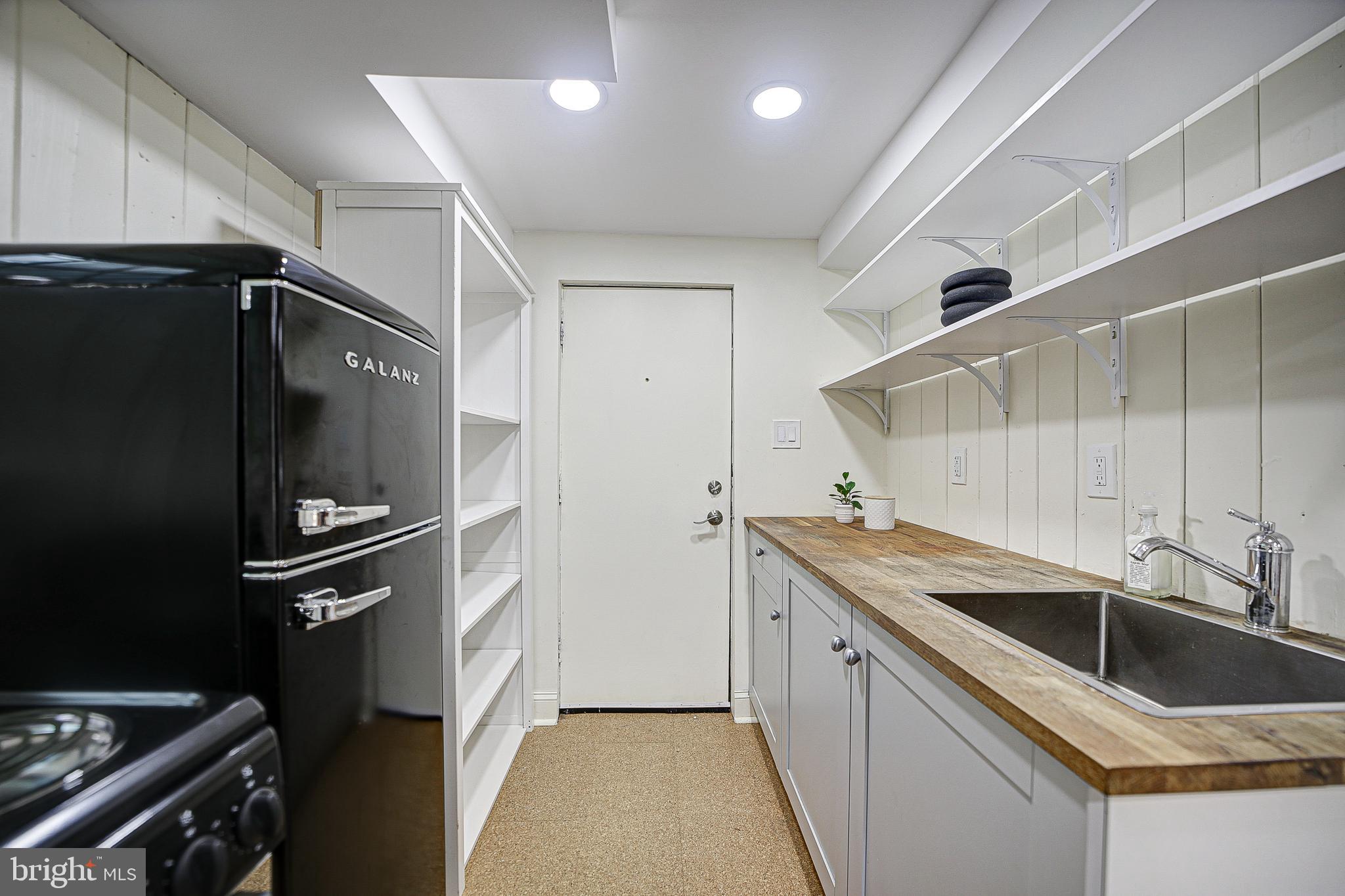 5348 29th Street Northwest Washington, DC 20015 - Photo 29 of 39 Kitchen with range and refrigerator/freezer