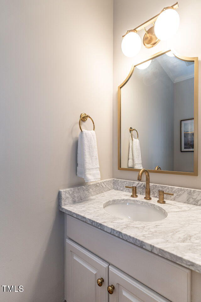 12205 Glenlivet Way Raleigh, NC 27613 - Photo 16 of 37 a bathroom with a granite countertop sink and a mirror