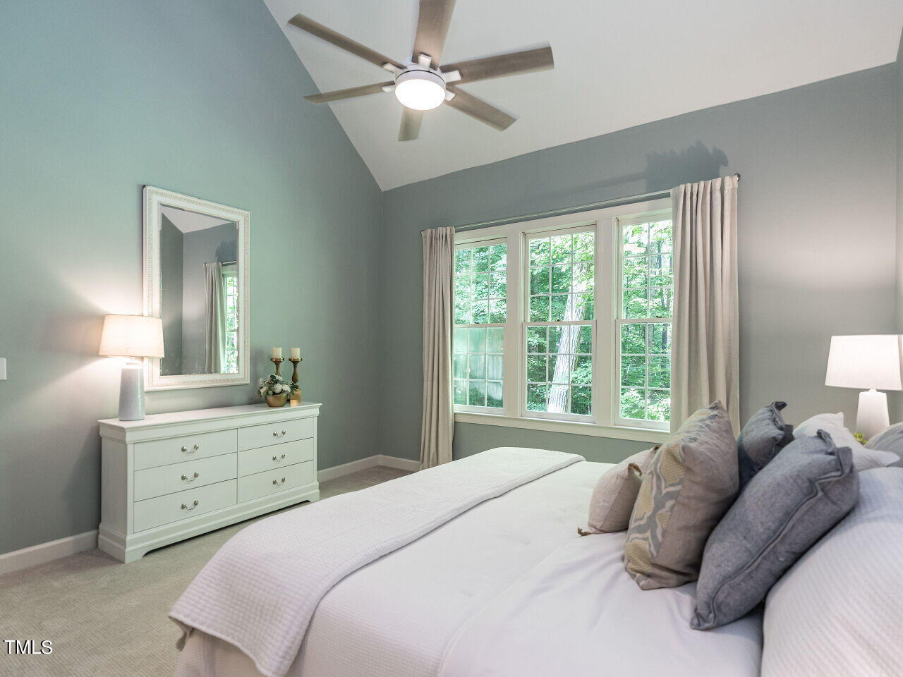 12205 Glenlivet Way Raleigh, NC 27613 - Photo 18 of 37 a bedroom with a bed chandelier and a window