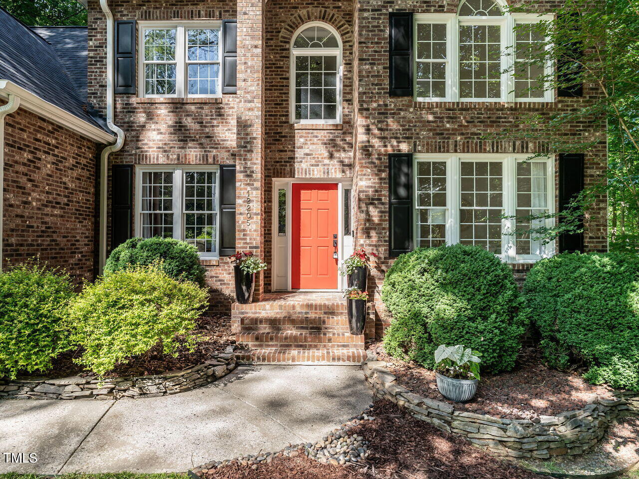 12205 Glenlivet Way Raleigh, NC 27613 - Photo 2 of 37 a front view of a house having yard