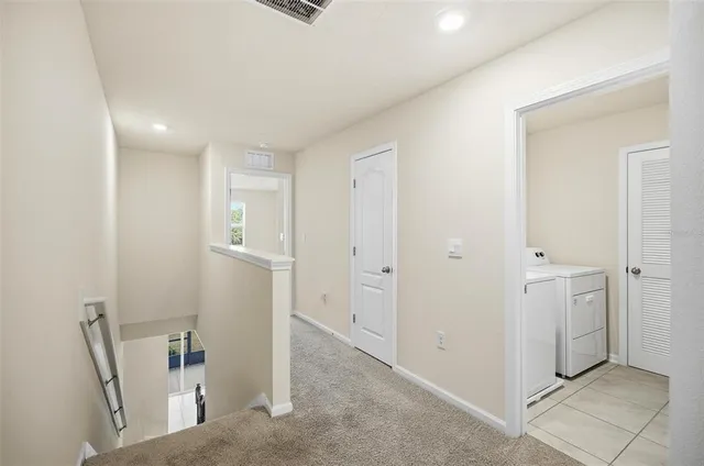 a view of a hallway with closet