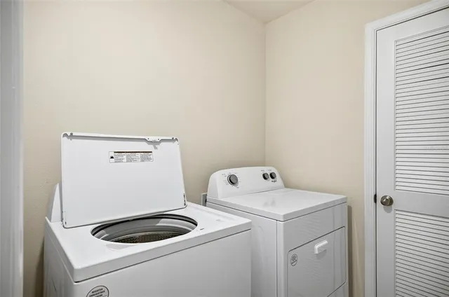 a utility room with dryer and washer