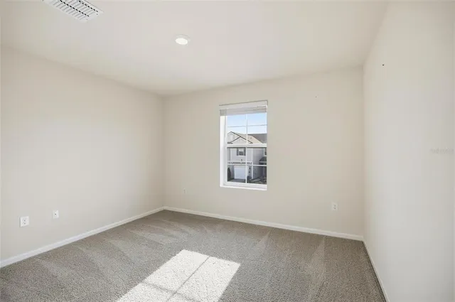 a view of an empty room and closet