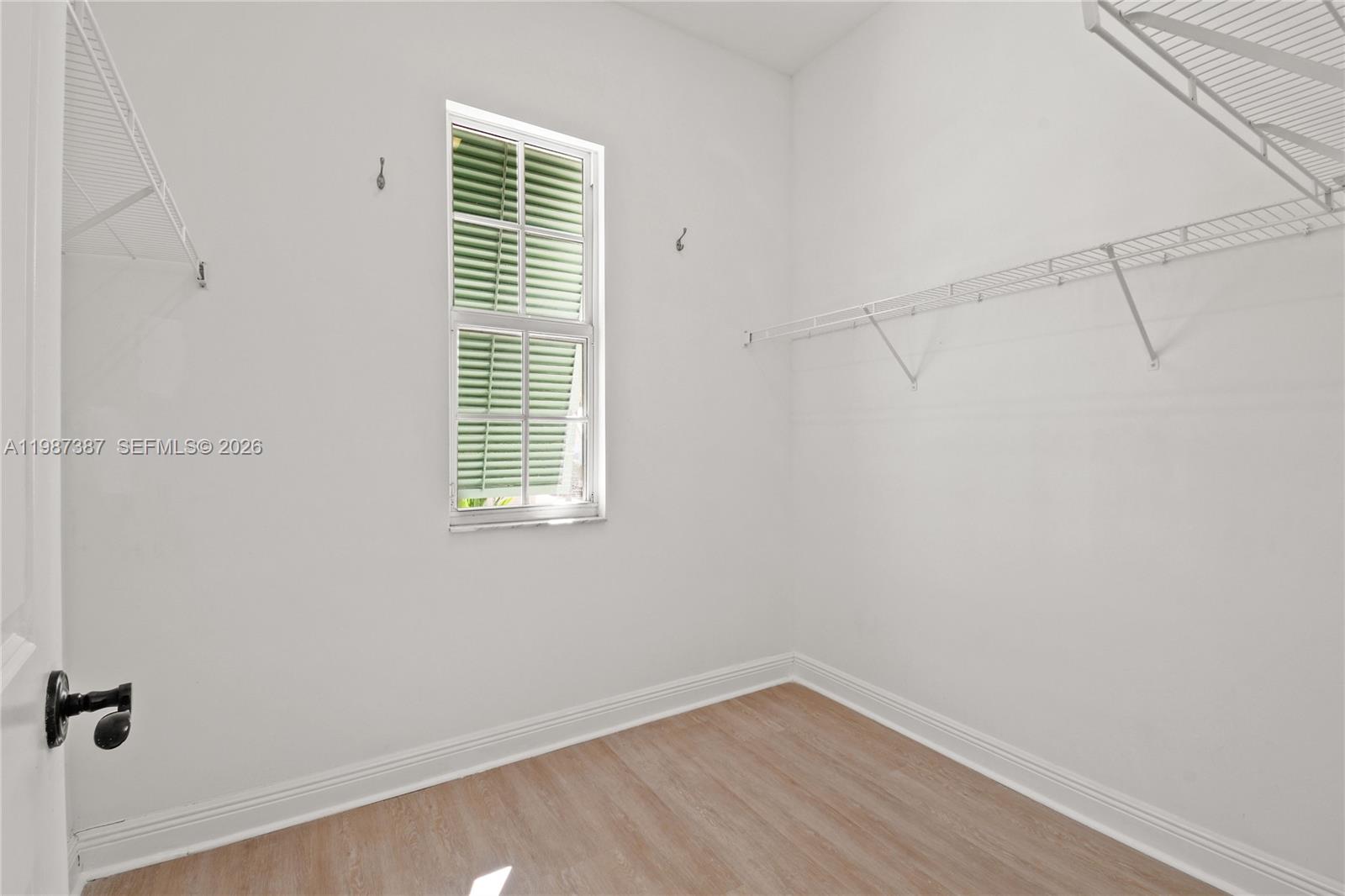 475 Ocean Ridge Way Juno Beach, FL 33408 - Photo 19 of 56 a view of a small space with wooden floor and a window