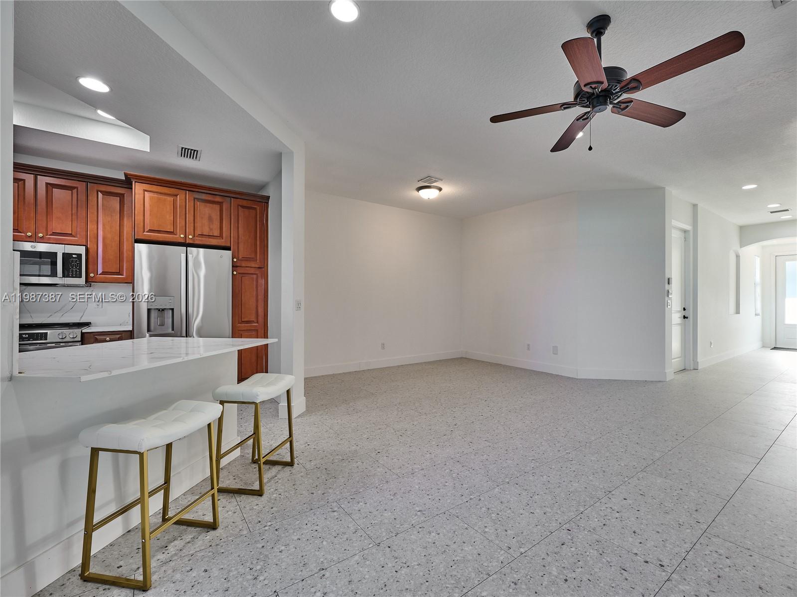 475 Ocean Ridge Way Juno Beach, FL 33408 - Photo 50 of 56 wooden floor in an empty room with a window