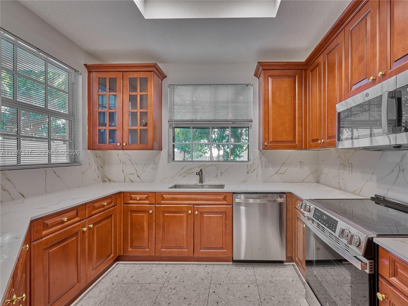 475 Ocean Ridge Way Juno Beach, FL 33408 - Photo 53 of 56 a kitchen that has a sink and a stove