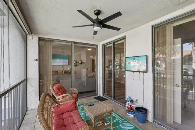 a view of a hallway with furniture and front door
