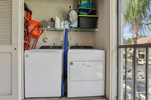a front view of a house with swimming pool and glass windows