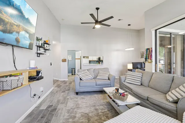 a view of a dining room with furniture and wooden floor