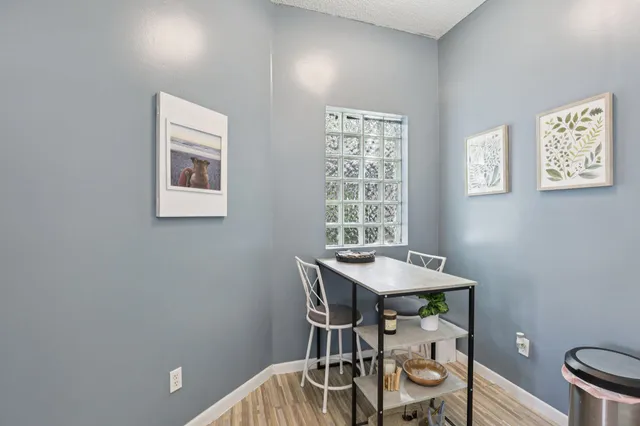 a kitchen with a sink a stove and cabinets