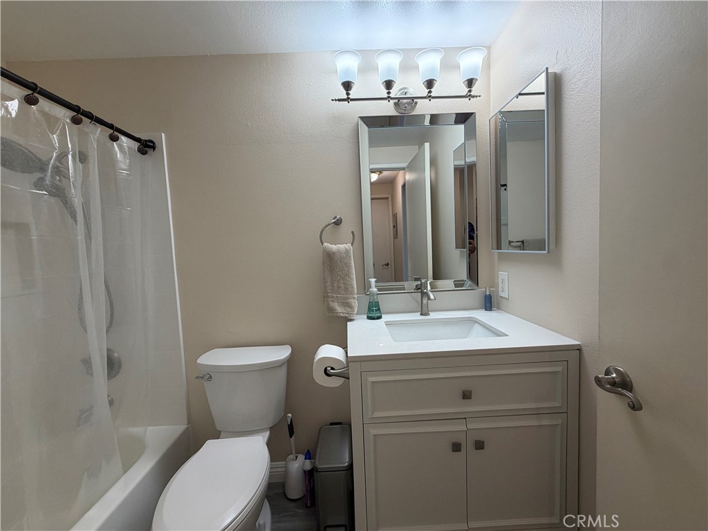 16040 Leffingwell Road Whittier, CA 90603 - Photo 11 of 17 a bathroom with a sink a toilet and shower