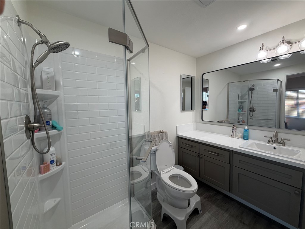 16040 Leffingwell Road Whittier, CA 90603 - Photo 14 of 17 a spacious bathroom with a sink a toilet and shower