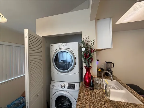 a living room with a washer and dryer