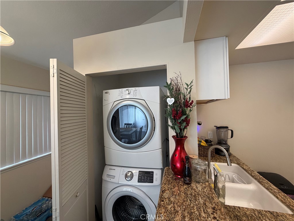 16040 Leffingwell Road Whittier, CA 90603 - Photo 9 of 17 a living room with a washer and dryer