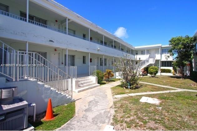 315 83rd Street, Unit 10 Miami Beach, FL 33141 - Photo 1 of 8 a view of a building with a patio