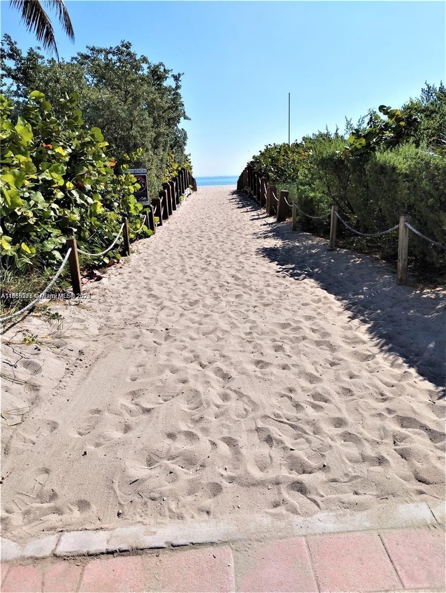 315 83rd Street, Unit 10 Miami Beach, FL 33141 - Photo 8 of 8 a view of a backyard of a house with a yard