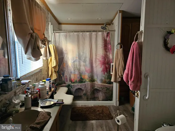 a bathroom with a bathtub and shower