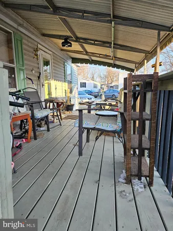 a view of a patio with table and chairs
