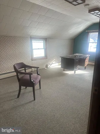 a view of livingroom with furniture and windows