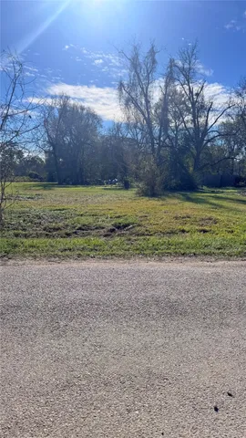 a view of a yard and an ocean beach