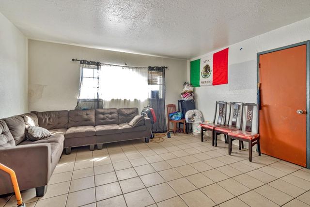 a kitchen with stainless steel appliances a stove a sink dishwasher and cabinets with wooden floor