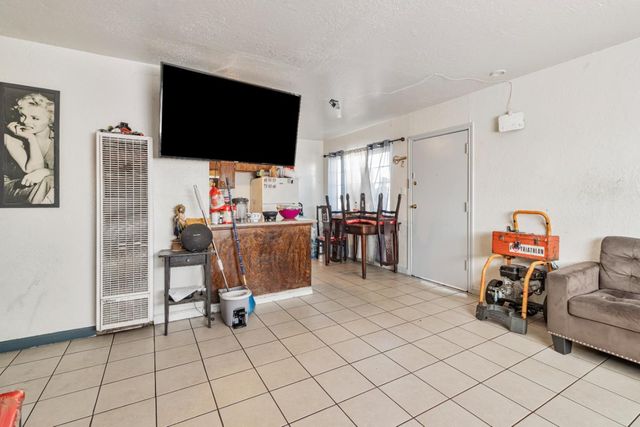 a kitchen with stainless steel appliances granite countertop a sink dishwasher stove and cabinets