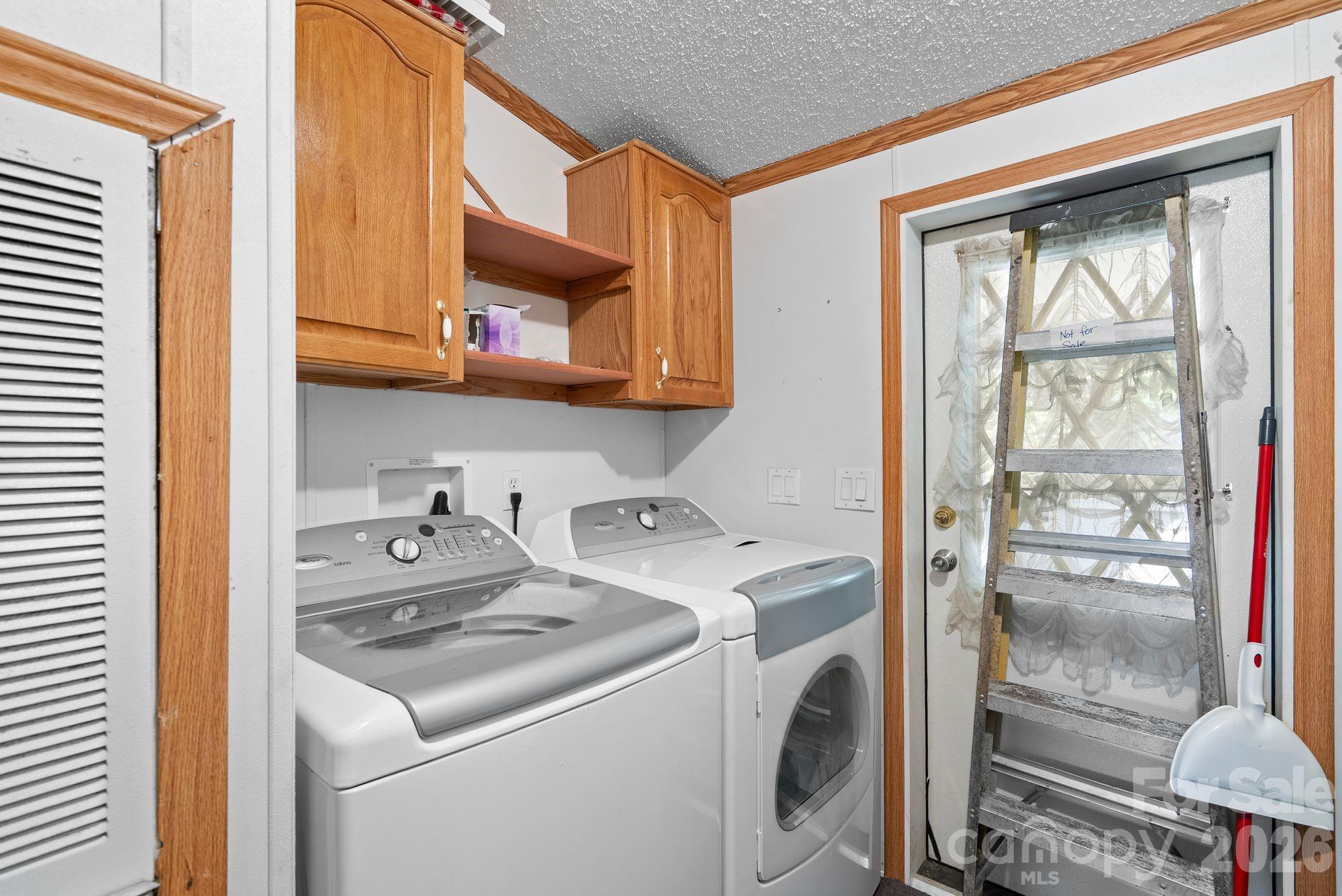 133 Spivey Mountain Road Asheville, NC 28806 - Photo 11 of 40 a utility room with dryer and washer