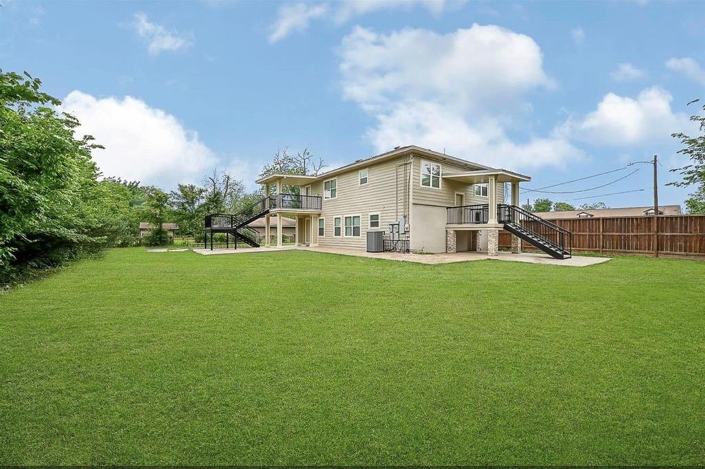 12430 Pecan Court Houston, TX 77013 - Photo 9 of 10 a view of a house with a big yard and large trees