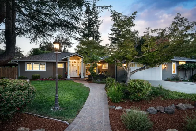 a front view of a house with garden