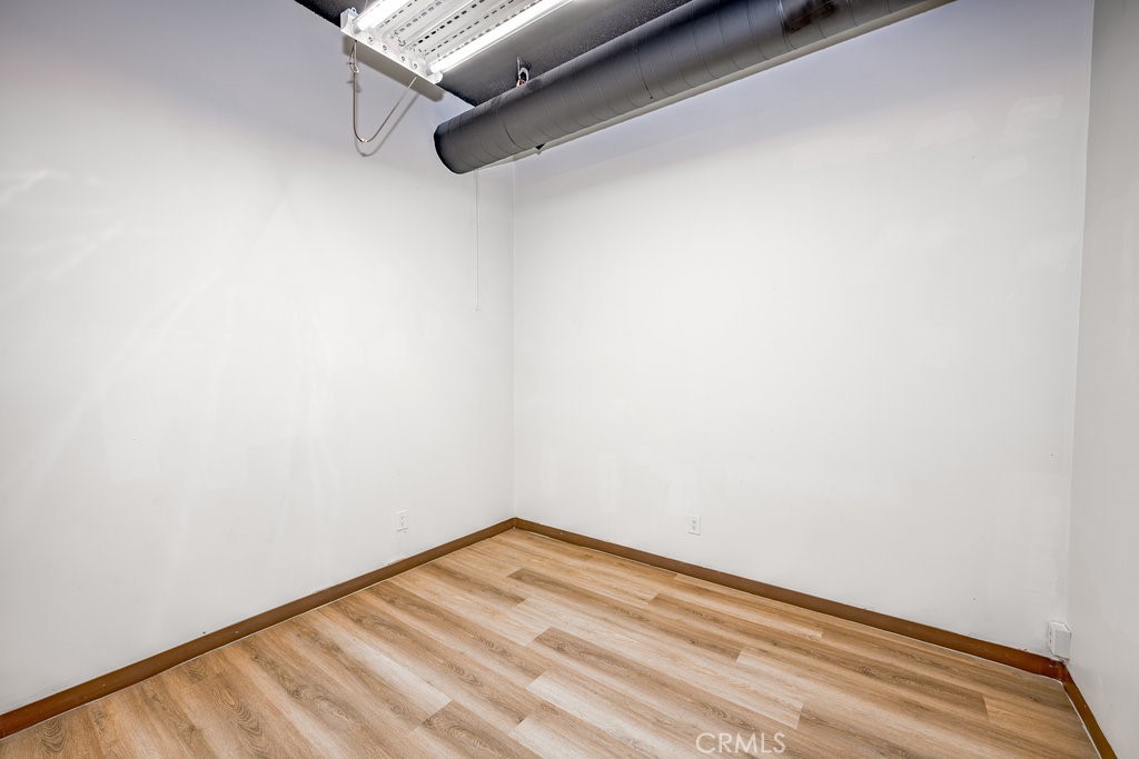 24609 Arch Street Newhall, CA 91321 - Photo 15 of 22 a view of a room with wooden floor