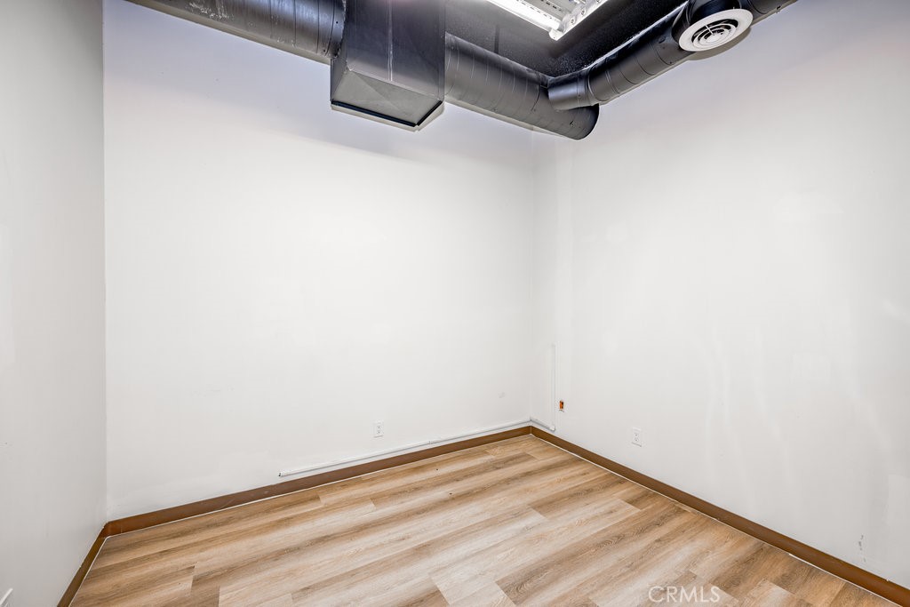 24609 Arch Street Newhall, CA 91321 - Photo 19 of 22 a view of a room with wooden floor