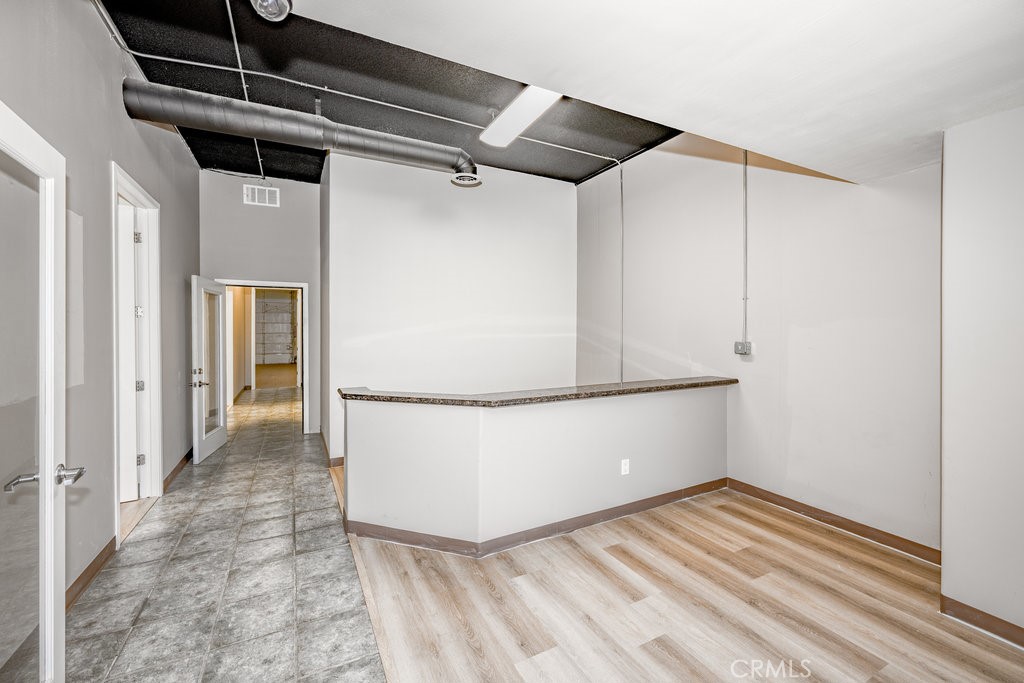 24609 Arch Street Newhall, CA 91321 - Photo 2 of 22 a view of a room with wooden floor