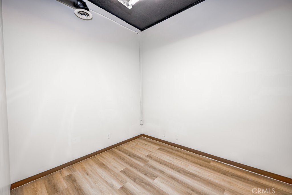 24609 Arch Street Newhall, CA 91321 - Photo 21 of 22 a view of a room with wooden floor