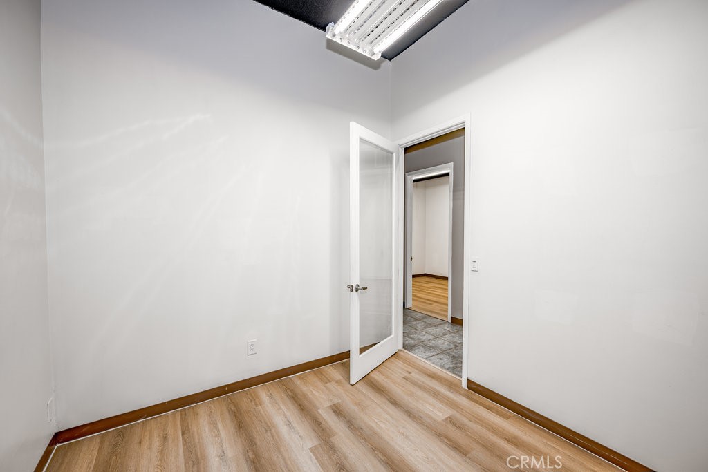 24609 Arch Street Newhall, CA 91321 - Photo 22 of 22 a view of an empty room and wooden floor