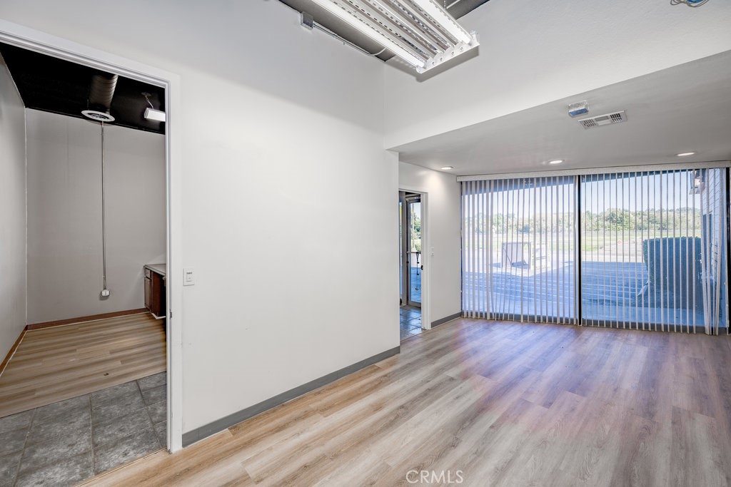 24609 Arch Street Newhall, CA 91321 - Photo 5 of 22 wooden floor in an empty room with a window
