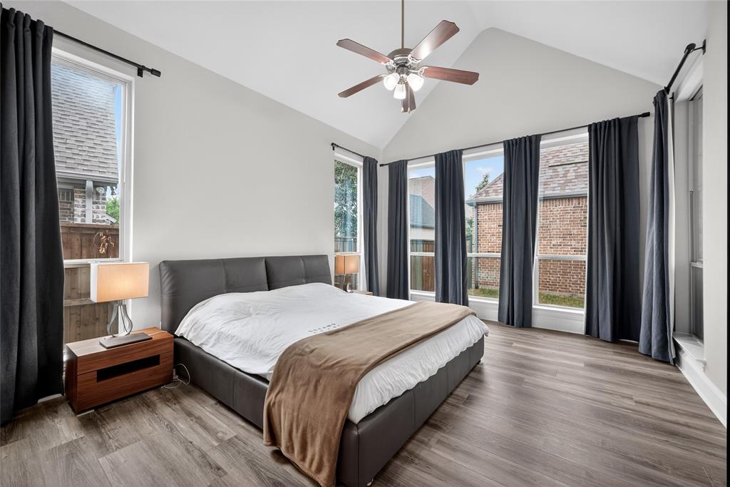 1039 Stephen Street Allen, TX 75013 - Photo 21 of 40 Bedroom with wood finished floors, ceiling fan, a high ceiling, and multiple windows