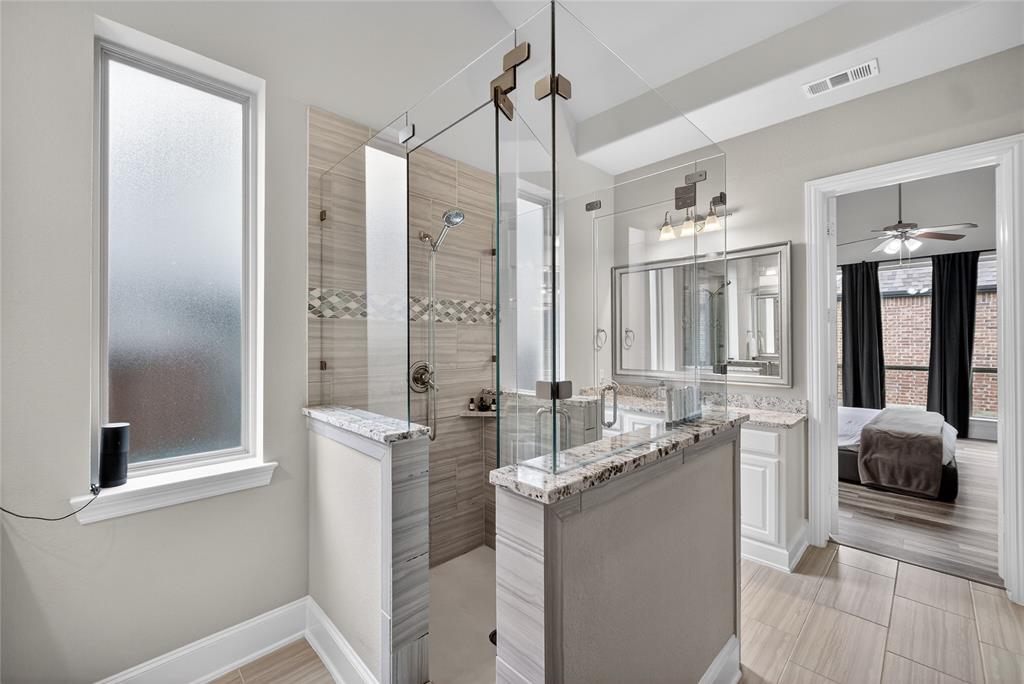 1039 Stephen Street Allen, TX 75013 - Photo 25 of 40 Ensuite bathroom with a shower stall, ceiling fan, and vanity