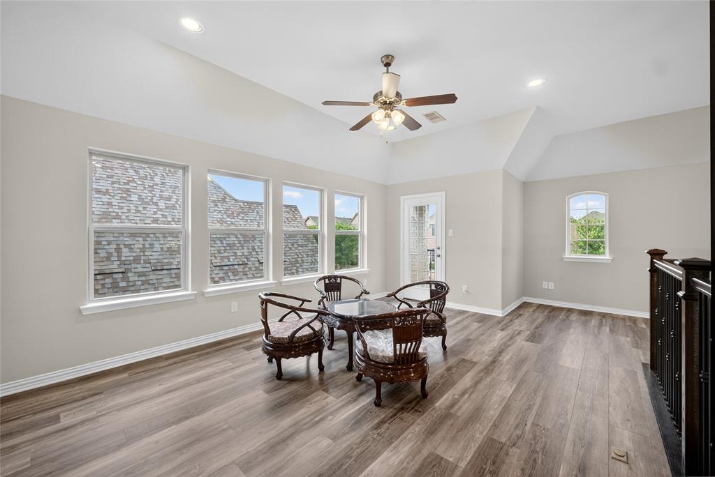 1039 Stephen Street Allen, TX 75013 - Photo 30 of 40 Dining room with ceiling fan, healthy amount of natural light, light wood finished floors, recessed lighting, and lofted ceiling
