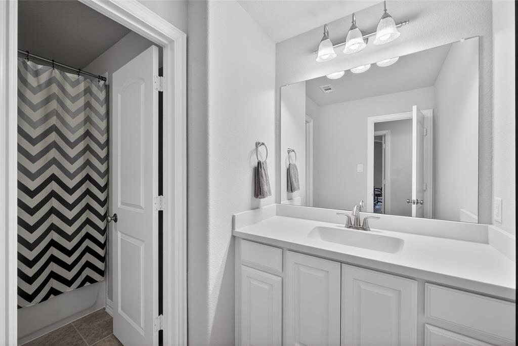 1039 Stephen Street Allen, TX 75013 - Photo 35 of 40 Full bath featuring vanity and light tile patterned floors