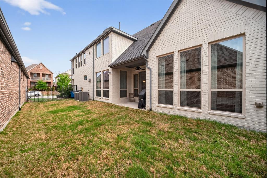 1039 Stephen Street Allen, TX 75013 - Photo 36 of 40 Rear view of property featuring a ceiling fan, a patio, and brick siding